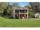 Two-story home with a white exterior, dark trim, and a well-manicured lawn at 3336 Myrtle St, Atlanta, GA 30354