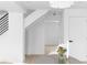 Bright hallway featuring hardwood floors, neutral walls, and staircase at 3336 Myrtle St, Atlanta, GA 30354