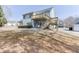 View of the backyard featuring a two-story deck with outdoor seating on a sunny day at 4803 Austin Hills Dr, Suwanee, GA 30024