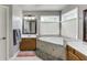 Ensuite bathroom featuring a large soaking tub, double vanities, and tile at 4803 Austin Hills Dr, Suwanee, GA 30024