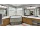 Ensuite bathroom featuring a large soaking tub, double vanities, and tile at 4803 Austin Hills Dr, Suwanee, GA 30024