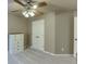Bedroom with neutral walls, carpet, ceiling fan, and double door closet at 4803 Austin Hills Dr, Suwanee, GA 30024