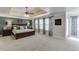 Spacious bedroom with a trey ceiling, carpet, and natural light through the windows at 4803 Austin Hills Dr, Suwanee, GA 30024