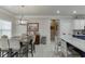 Cozy dining area adjacent to the kitchen with a stylish pendant light fixture at 4803 Austin Hills Dr, Suwanee, GA 30024