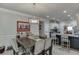Stylish dining room with a view into the kitchen, featuring comfortable seating at 4803 Austin Hills Dr, Suwanee, GA 30024