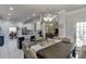 Dining area featuring modern decor, views into the kitchen, and natural light at 4803 Austin Hills Dr, Suwanee, GA 30024