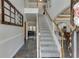 Elegant foyer featuring a staircase with wooden railings, showcasing a glimpse of the home's interior design at 4803 Austin Hills Dr, Suwanee, GA 30024