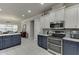 Modern kitchen with stainless steel appliances and a view into the dining area at 4803 Austin Hills Dr, Suwanee, GA 30024