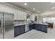 Well-designed kitchen featuring modern appliances, granite countertops, and a breakfast bar at 4803 Austin Hills Dr, Suwanee, GA 30024