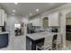 Elegant kitchen with an island and stainless steel appliances, and granite countertops at 4803 Austin Hills Dr, Suwanee, GA 30024