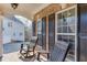 Inviting front porch with seating, showcasing the home's architectural details and a cozy outdoor space at 4803 Austin Hills Dr, Suwanee, GA 30024