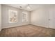 Neutral bedroom with two windows providing natural light and plush carpeting at 5110 Montcalm Sw Dr, Atlanta, GA 30331