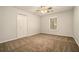 Cozy bedroom featuring neutral paint, carpeted flooring and a window offering natural light at 5110 Montcalm Sw Dr, Atlanta, GA 30331