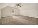 Spacious, carpeted bedroom with a vaulted ceiling, a window, and a ceiling fan at 5110 Montcalm Sw Dr, Atlanta, GA 30331