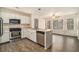 Bright kitchen featuring stainless steel appliances, white cabinetry, and a large window with natural light at 5110 Montcalm Sw Dr, Atlanta, GA 30331