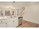 Bright kitchen with stainless steel appliances, double sink, and adjacent staircase at 5110 Montcalm Sw Dr, Atlanta, GA 30331
