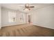 Inviting living room boasts neutral paint, plush carpeting, and lots of natural light from large windows at 5110 Montcalm Sw Dr, Atlanta, GA 30331