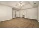 Expansive main bedroom features tray ceiling, neutral paint, plush carpet and attached ensuite bathroom at 5110 Montcalm Sw Dr, Atlanta, GA 30331