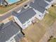 Aerial view of the backyard and the surrounding neighborhood at 117 Villanueva Rd, Woodstock, GA 30188