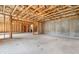 Unfinished basement with concrete floor and exposed beams awaiting your custom design and finishing touches at 117 Villanueva Rd, Woodstock, GA 30188