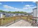 Exterior shot from deck overlooking other properties with blue skies at 117 Villanueva Rd, Woodstock, GA 30188