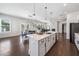 Large island overlooking breakfast area. Modern kitchen features stainless appliances and updated cabinets at 117 Villanueva Rd, Woodstock, GA 30188