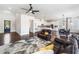 Open-concept living room with seamless access to the kitchen and dining areas at 117 Villanueva Rd, Woodstock, GA 30188