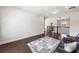 Open loft area features dark wood floors, a black railing, and recessed lighting at 117 Villanueva Rd, Woodstock, GA 30188