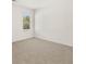 Bedroom with neutral walls and carpet features large window for ample light at 12098 Conrad Cir, Hampton, GA 30228