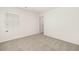 Bedroom with neutral walls and carpet features large window for ample light at 12098 Conrad Cir, Hampton, GA 30228