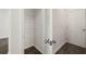 Small storage closet with vinyl floors and wire shelving, great for organization at 12098 Conrad Cir, Hampton, GA 30228