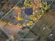 A private estate featuring a pond, mature trees, and verdant acreage at 12421 Highway 36, Covington, GA 30014