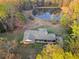 Charming home with private backyard pond surrounded by lush trees offering a serene setting at 12421 Highway 36, Covington, GA 30014