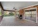 View of the back deck with ceiling fan, grill and view of the yard at 12421 Highway 36, Covington, GA 30014
