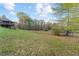 Large, open backyard with lush greenery and mature trees offers space and privacy at 12421 Highway 36, Covington, GA 30014