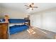 Bright bedroom featuring bunk beds, wood floors, and double closets at 12421 Highway 36, Covington, GA 30014
