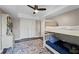 Comfortable bedroom with a bunk bed, closet, and colorful rug creating a cozy and functional space at 12421 Highway 36, Covington, GA 30014