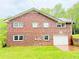 Exterior view of this beautiful brick home with an attached garage at 12421 Highway 36, Covington, GA 30014