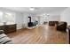 Spacious living room with hardwood floors, wood burning stove, and lots of natural light at 12421 Highway 36, Covington, GA 30014