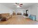 Large living room with hardwood floors and ample seating at 12421 Highway 36, Covington, GA 30014