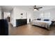 Bright and airy main bedroom featuring hardwood floors, a ceiling fan, and natural light, providing a comfortable retreat at 12421 Highway 36, Covington, GA 30014