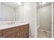 Bathroom with a modern wood vanity, white countertop, and a large framed mirror at 3640 Barbara Dr, Douglasville, GA 30135