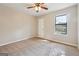Neutral carpeted bedroom with a ceiling fan and natural light from the window at 3640 Barbara Dr, Douglasville, GA 30135