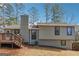 Rear exterior view of a home with a deck, siding, and a chimney at 3640 Barbara Dr, Douglasville, GA 30135
