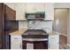 Close-up of the stainless steel oven in the kitchen, featuring granite countertops and white cabinets at 3640 Barbara Dr, Douglasville, GA 30135
