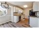 Well lit kitchen with stainless steel appliances, granite countertops and hardwood flooring at 3640 Barbara Dr, Douglasville, GA 30135