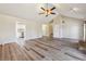 Open concept living room boasts hardwood floors, a vaulted ceiling, and easy access to the kitchen at 3640 Barbara Dr, Douglasville, GA 30135