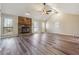 Spacious living room featuring hardwood floors and a stone fireplace at 3640 Barbara Dr, Douglasville, GA 30135