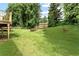 Large backyard with a storage shed and a covered deck at 4135 Shoshone Valley Rd, Marietta, GA 30068