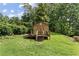 Exterior of a wooden backyard shed with a small front porch at 4135 Shoshone Valley Rd, Marietta, GA 30068